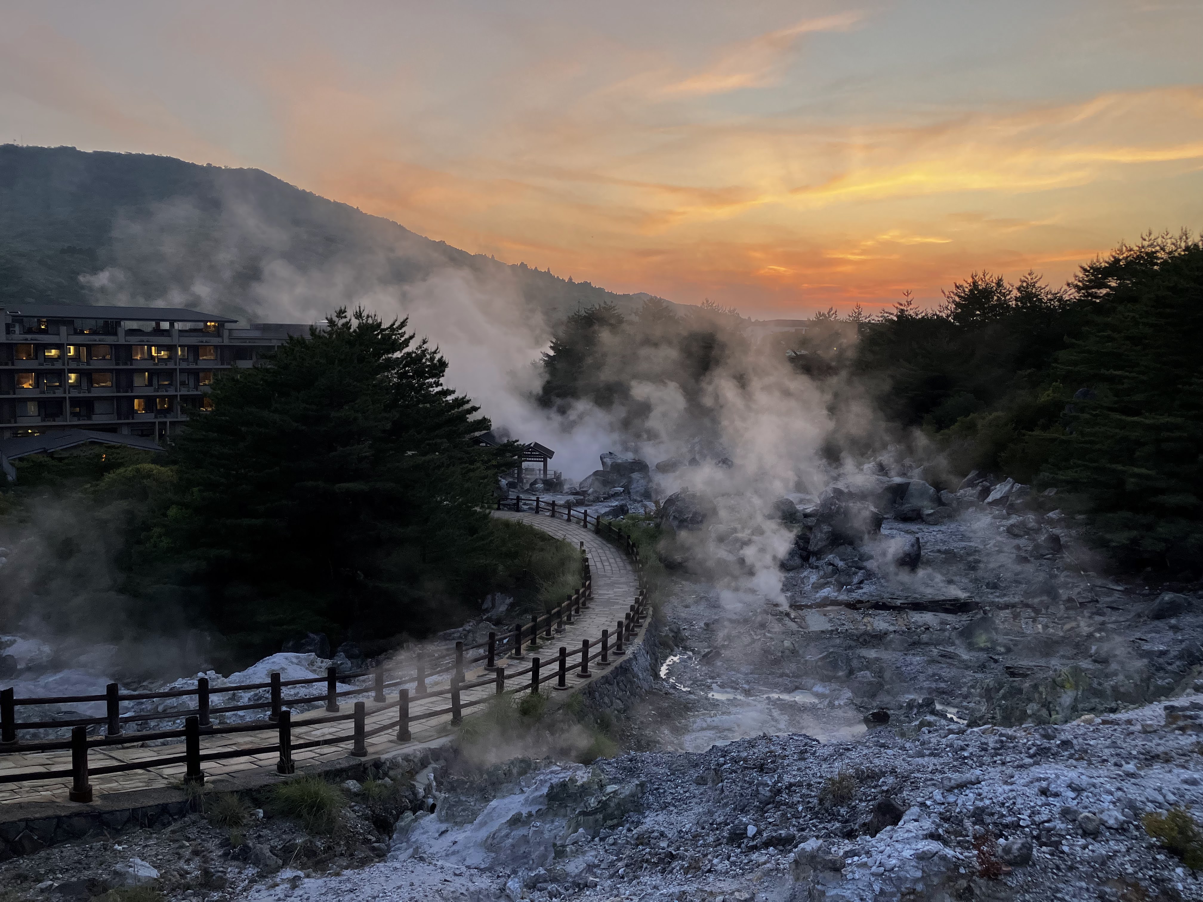Steam rising from Unzen Hells at sunset